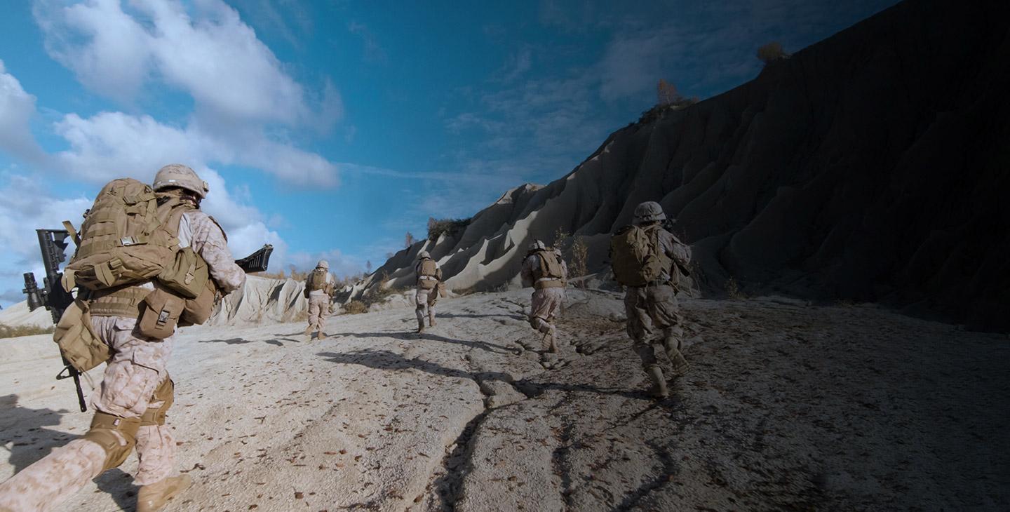 地面 operations team running through the sand